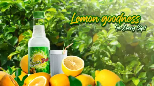 Bottle of Nimbu Fresh sorrounded by lemons where text Lemon Goodness In Every Sip is written